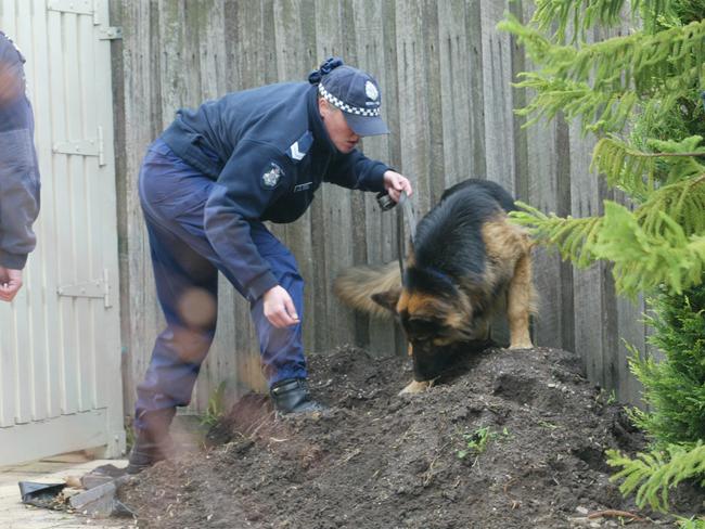 Forensic police and detectives search the Sharpes’ family home in 2004. Picture: Supplied