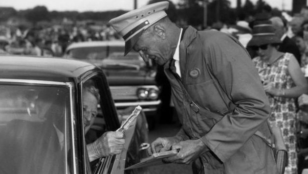 Premier Frank Nicklin pays the first Bribie Bridge toll with a 10 shilling note. Picture: Queensland State Archives