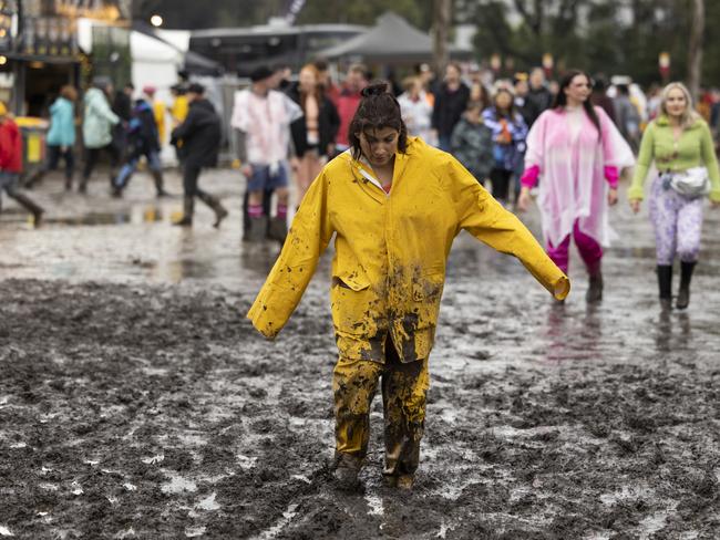 BYRON BAY, AUSTRALIA - JULY 22: A festival goer is seen in mud during Splendour in the Grass 2022 at North Byron Parklands on July 22, 2022 in Byron Bay, Australia. Festival organisers have cancelled the first day of performances at Splendour in the Grass due to heavy rain at the festival site. (Photo by Matt Jelonek/Getty Images)