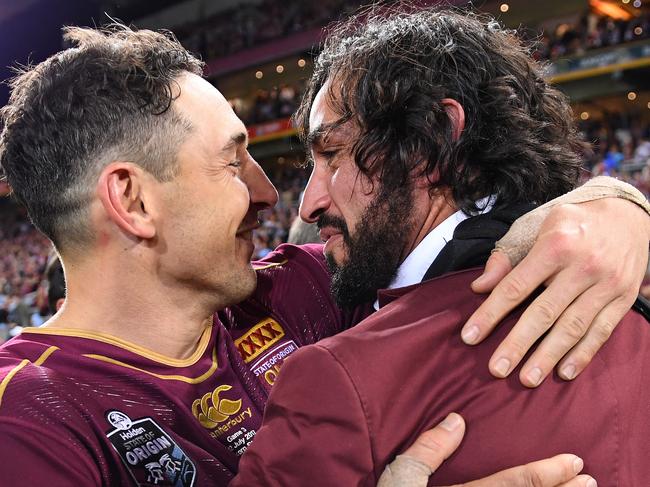 Johnathan Thurston (right) and Billy Slater of the Queensland Maroons celebrate following State of Origin Game 3 between the Queensland Maroons and NSW Blues, at Suncorp Stadium in Brisbane, on Wednesday, July 12, 2017. (AAP Image/Dave Hunt) NO ARCHIVING, EDITORIAL USE ONLY