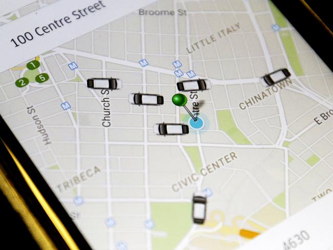 FILE - In this Wednesday, March 18, 2015, file photo, the Uber application displays cars available for a pick up at 100 Centre St on a cell phone in New York. In four years Uber has gone from nearly non-existent to more than 26,000 drivers, joining over 13, 000 New York City taxis. (AP Photo/Mary Altaffer, File)