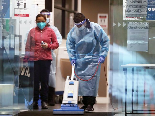 Cleaners at Arcare Maidstone Aged Care on Monday after it was listed as a COVID site. Picture: David Crosling