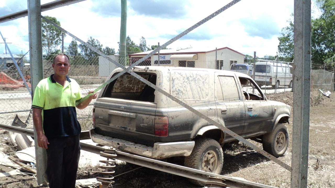 Brisbane Rd business owner Jason Rees and flood devastation from January 2013Photo Lee Gailer / Gympie Times