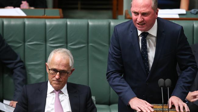 A fired-up Barnaby Joyce, right, returns serve in Parliament House yesterday while Malcolm Turnbull listens. Picture: Kym Smith