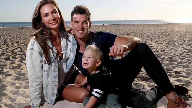 Kate Whiting and James "Harry" Harris with their son Xavier at Glenelg in 2017. Photo: Calum Robertson