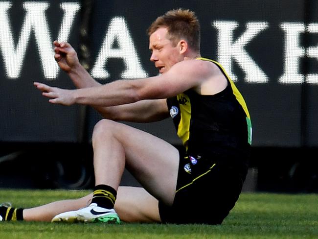 Jack Riewoldt of the Tigers is injured in a marking contest during the Round 10 AFL match between the Richmond Tigers and the St Kilda Saints at the MCG in Melbourne, Saturday, May 26, 2018. (AAP Image/Tracey Nearmy) NO ARCHIVING, EDITORIAL USE ONLY