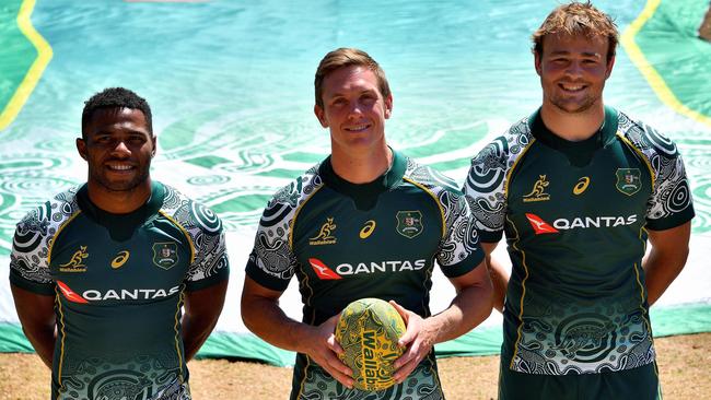 Filipo Daugunu, left, Dane Haylett-Petty, centre, and Harry Wilson pose in the new Wallabies Indigenous jersey Picture: AFP