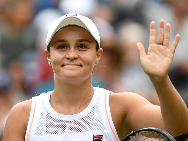 Australia's Ashleigh Barty celebrates beating China's Zheng Saisai during their women's singles first round match on the second day of the 2019 Wimbledon Championships at The All England Lawn Tennis Club in Wimbledon, southwest London, on July 2, 2019. (Photo by Daniel LEAL-OLIVAS / AFP) / RESTRICTED TO EDITORIAL USE