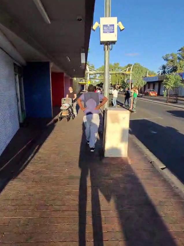 The man armed with two knives walked past a mother and her 12-month-old child as he left the scene towards the Todd River. Picture: Supplied