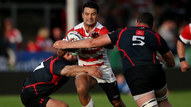 Japan's Craig Wing, second left, is tackled by Georgia's Konstantine Mikautadze during the rugby union World Cup warm up match against Georgia, at Kingsholm Stadium, Gloucester, England Saturday Sept. 5, 2015. (Scott Heavey/PA Wire via AP) UNITED KINGDOM OUT, NO SALES, NO ARCHIVE