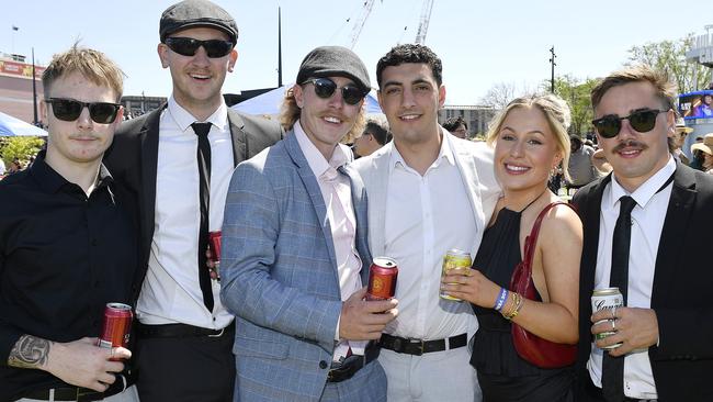 Caulfield Guineas horse race meeting, Caulfield, Victoria, Saturday 12th October 2024. Faces in the crowd. Pictured enjoying the race meeting are Finn, Lindsey, Peter, Daniel, Jazmin and Tom. Picture: Andrew Batsch