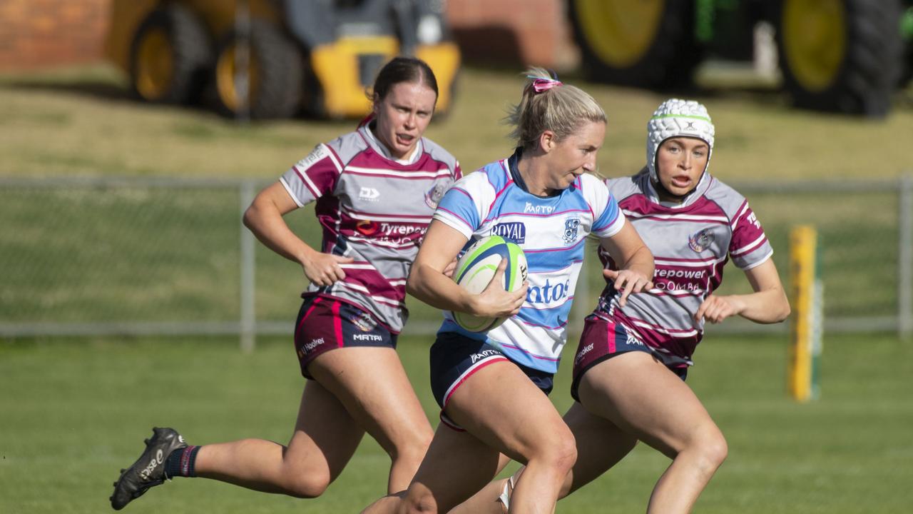 Bears players Paige Carpenter and Taylor Logan chase Roma’s Meg Jakins during a Downs Rugby Sevens match. The Darling Downs women’s rugby sevens competition is named in honour of Roma’s Emilee Cherry. Picture: Nev Madsen.