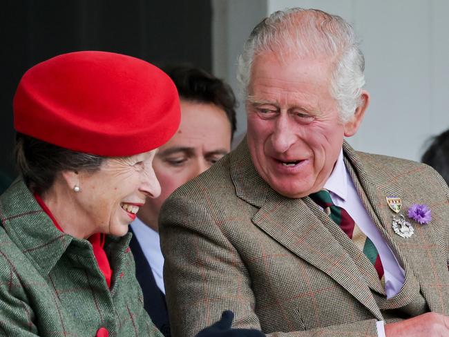 BRAEMAR, SCOTLAND - SEPTEMBER 03: Anne, Princess Royal and Prince Charles, Prince of Wales, known as the Duke of Rothesay when in Scotland laughing during the Braemar Highland Gathering at the Princess Royal & Duke of Fife Memorial Park on September 03, 2022 in Braemar, Scotland. The Braemar Gathering is the most famous of the Highland Games and is known worldwide. Each year thousands of visitors descend on this small Scottish village on the first Saturday in September to watch one of the more colourful Scottish traditions. The Gathering has a long history and in its modern form it stretches back nearly 200 years. The Queen Elizabeth Platinum Jubilee Archway was designed by architect Keith Ross, erected to celebrate 70 years of Her Majesty as monarch and as Patron of The Braemar Royal Highland Society, organiser of the annual Braemar Gathering. (Photo by Chris Jackson/Getty Images)