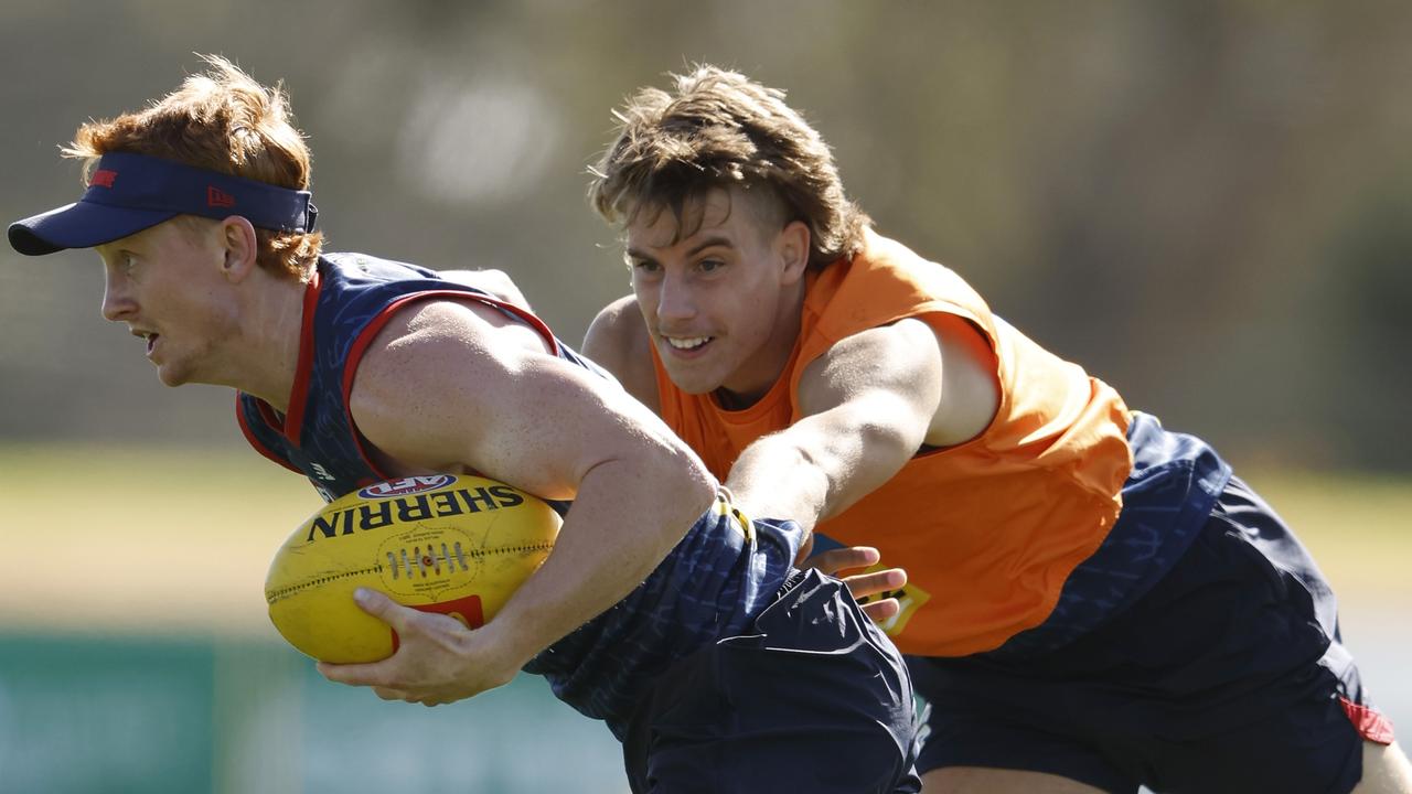 Caleb Windsor (right) tackles Jake Bowey after the Demons announced he will debut in Opening Round. Picture: Darrian Traynor/Getty Images