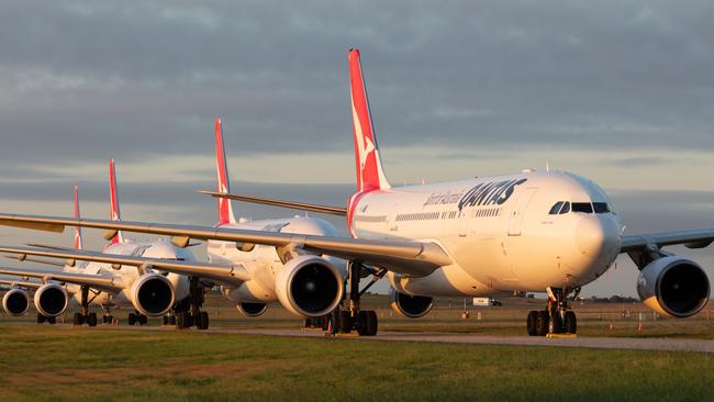 A row of four Qantas A330's sit grounded at Avalon air base as the airline massively scales-down its operations due to COVID-19 disruption. PIC: Chung Choo