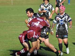 COMING THROUGH: Ryan Binge carts the ball into the heart of the Cougars defensive line during the Lower Clarence Magpies v Casino Cougars NRRRL first grade clash . Picture: Makeely Heron