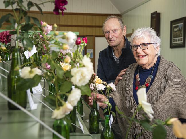 Henry and Jane Bracey admire the Queensland Rose Society Darling Downs Group autumn show roses, Saturday, May 4, 2024. Picture: Kevin Farmer