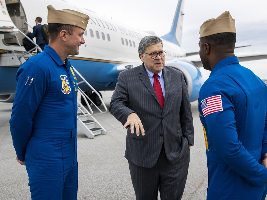 Attorney-General William Barr speaks with lieutenants of the US Navy Blue Angels flight demonstration teams. Picture: AP Photo/Patrick Semansky