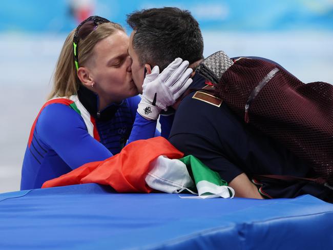 BEIJING, CHINA - FEBRUARY 07: Arianna Fontana of Team Italy celebrates with partner after winning the Gold medal during the Women's 500m Final A on day three of the Beijing 2022 Winter Olympic Games at Capital Indoor Stadium on February 07, 2022 in Beijing, China. (Photo by Matthew Stockman/Getty Images)