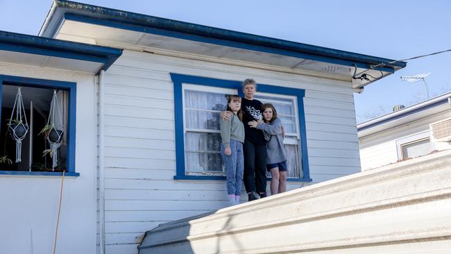 Indra Dhanusha and her kids were forced to seek refuge on their roof. Picture Danielle Smith