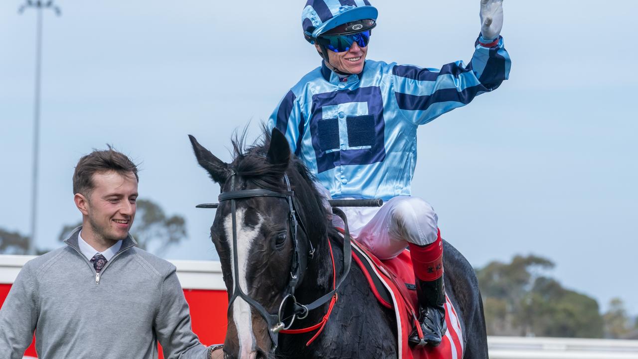 Craig Williams waves to the crowd after winning the Geelong Cp aboard Onesmoothoperator. Picture: Jay Town/Racing Photos via Getty Images