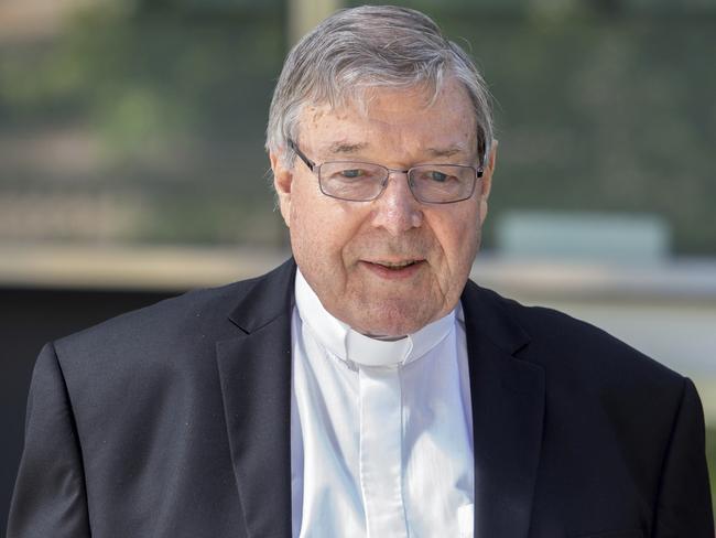 In this Dec 10, 2018, photo, Cardinal George Pell, the most senior Catholic cleric to face sex charges, departs an Australian court. Pell was sentenced in an Australian court on Wednesday, March 13, 2019 to 6 years in prison for molesting two choirboys in a Melbourne cathedral more than 20 years ago.  (AP Photo/Asanka Brendon Ratnayake)