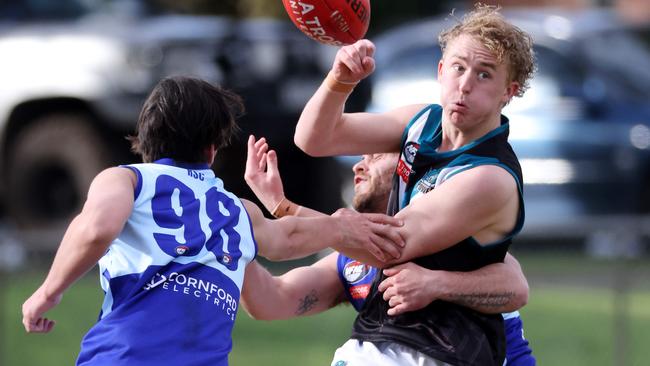 Kaiden Arthur fires out a handball for Laurimar. Picture: George Salpigtidis