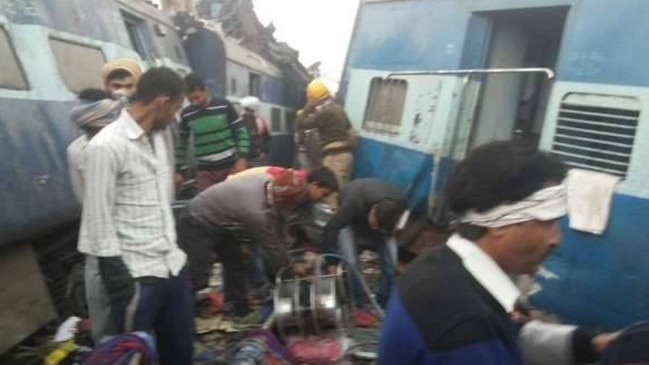 Grim search: Volunteers and emergency workers scour the mangled wreckage. Picture: Supplied