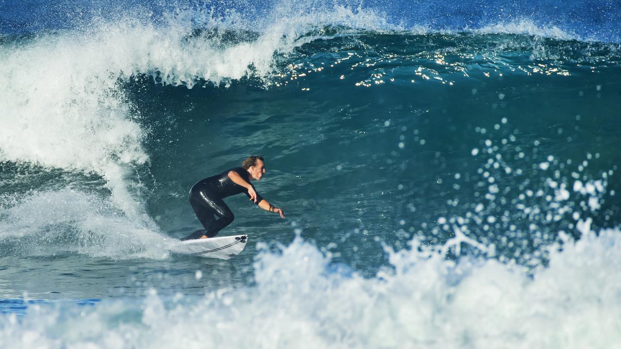 A surfer takes off at Sunrise Beach as a southerly swell from an east coast low pushes big waves into southeast Queensland earlier this month. Photo Lachie Millard