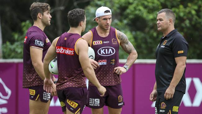 Anthony Seibold (right) speaks to Patrick Carrigan, Brodie Croft and Darius Boyd. Picture: AAP/Glenn Hunt