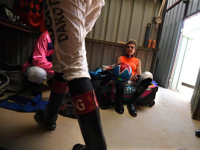 EMBARGO FOR TWAM 03 SEPTEMBER 2022. FEE MAY APPLY.  Jockey Cecily Eaton is seen between races at the Birdsville Races in Birdsville, Queensland, Saturday, September 7, 2019. Birdsville is situated on the edge of the Simpson Desert, 1590 kms west of Brisbane and its normal population of around 100 people swells to a crowd of more than 6000 over the Birdsville Cup racing weekend. (AAP Image/Dan Peled) NO ARCHIVING