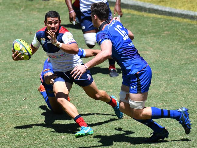 Izaia Perese (left) of the Reds is tackled by Jack Cornelsen (right) ( AAP Image/Darren England)