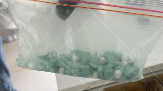 A Mongols bikie gang member has been arrested in Darwin following a major police operation that uncovered cash and drugs linked to an alleged trafficking operation. Picture: NT Police / Supplied.