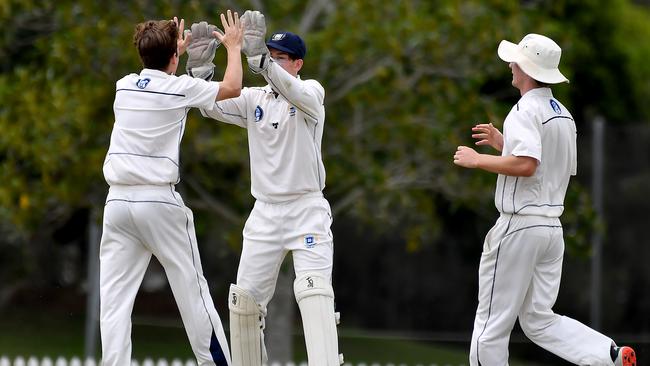 Brisbane Grammar School players celebrate a wicke. Picture, John Gass