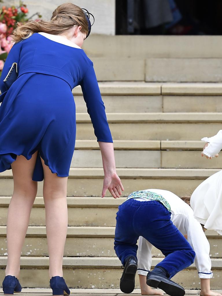 Lady Louise Mountbatten-Windsor helps one of the page boys. Picture: Getty