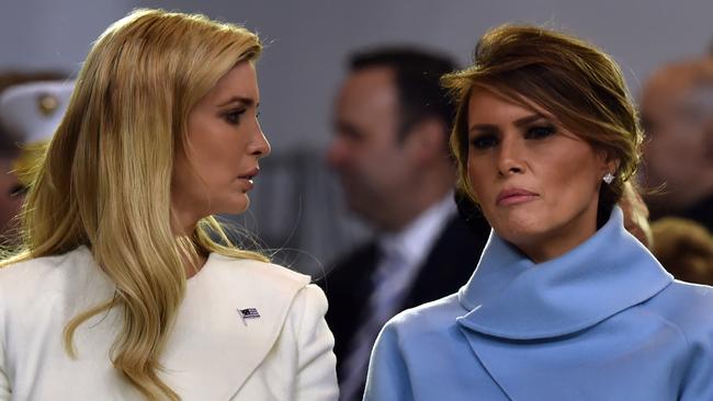 US First Lady Melania Trump speaks with Ivanka Trump during the presidential inaugural parade for US President Donald Trump on January 20, 2017 in Washington, DC. / AFP PHOTO / Nicholas Kamm