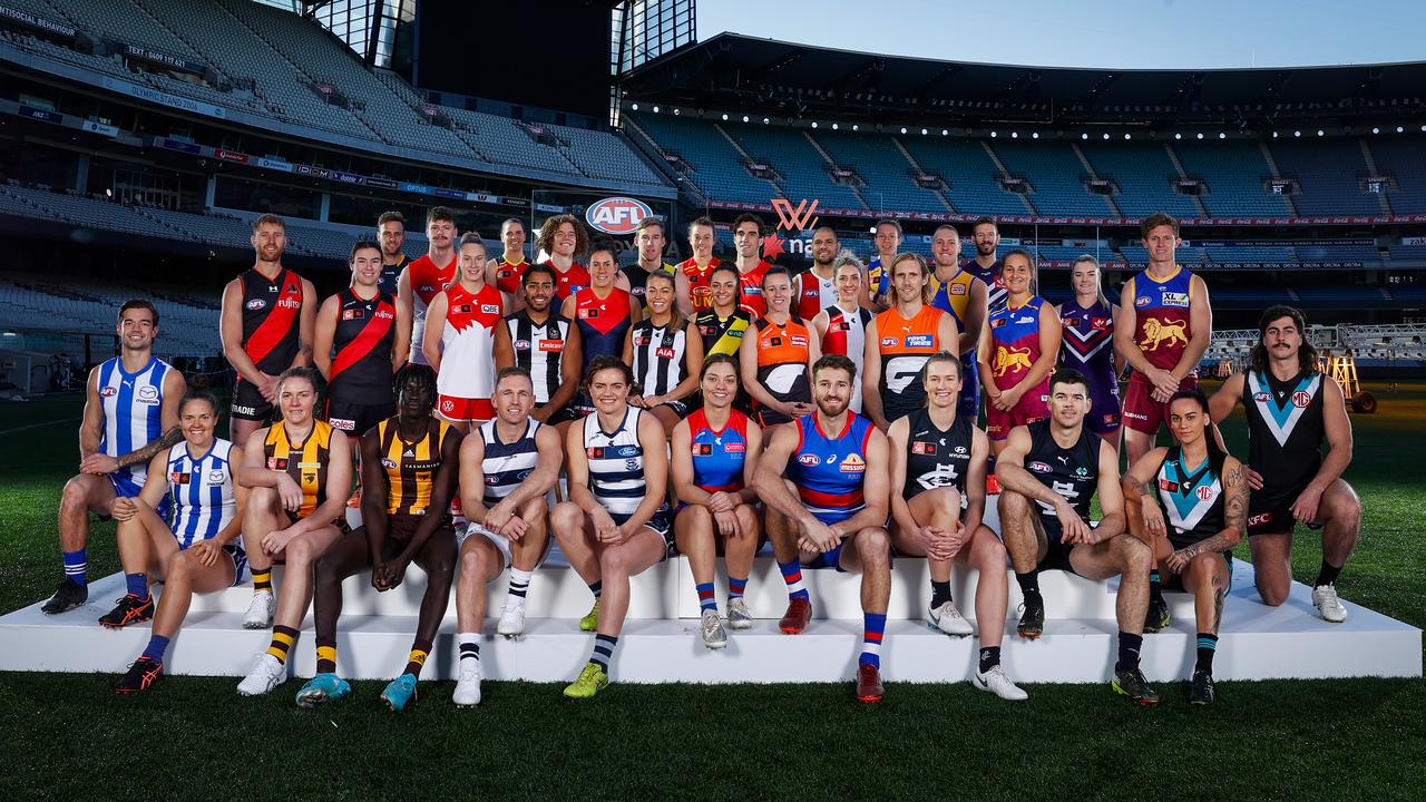MELBOURNE, AUSTRALIA - JULY 21: Representatives from the AFLs 18 mens and womens teams pose for a legacy photograph during an AFL Media Opportunity at the Melbourne Cricket Ground on July 21, 2022 in Melbourne, Australia. (Photo by Michael Willson/AFL Photos via Getty Images)