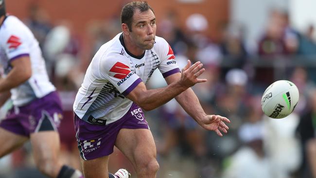 Melbourne Storm captain Cameron Smith passes the ball against Manly on Saturday. Picture: Brett Costello