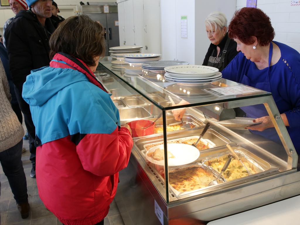 Vinnies Kitchen Inc with volunteers Helen Turner (Blue top) serves meals to the homeless. Picture Norm Oorloff