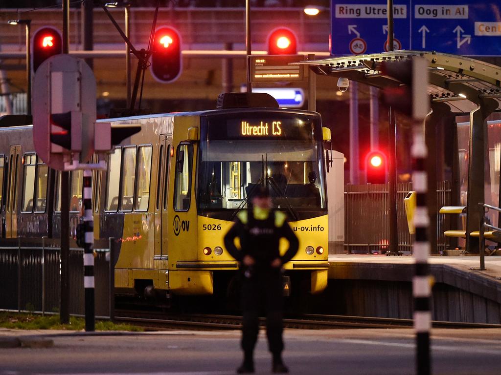 A policeman stands guard near a tram where the gunman opened fire. Picture: AFP