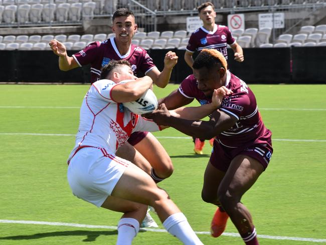 Campbell Lyons tries to evade the tackle of Alton Naiyep. Picture: Sean Teuma