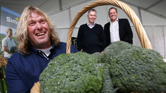 Vegetable producer Stuart Greenhill, from left, Coles managing director John Durkan and Simplot managing director Terry O'Brien are all smiles after today’s announcement of the new contract at Quoiba, near Devonport. Picture: CHRIS KIDD