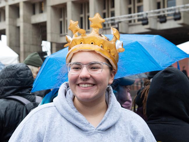 A young royal fan wears an inflatable crown as she joins crowds outside City Hall Plaza. Picture: AFP.