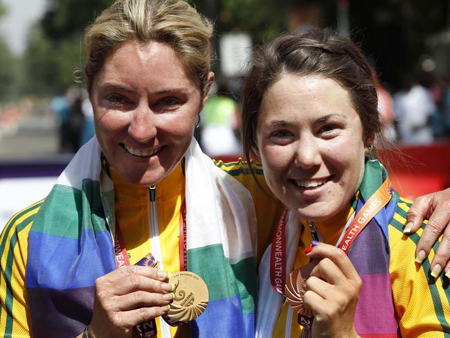 Australia's gold winner Rochelle Gilmore, left and Bronze winner Hosking, right pose during the medal ceremony after the women's 112km cycling road race at the Commonwealth Games in New Delhi in 2010.