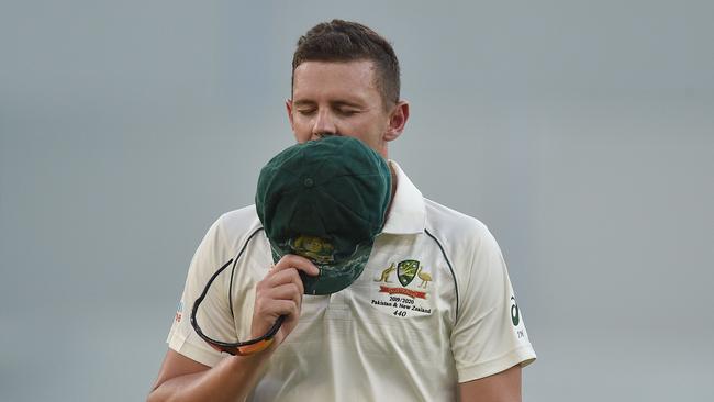 Australia's Josh Hazlewood walks off the field after injuring his hamstring. Picture: AFP