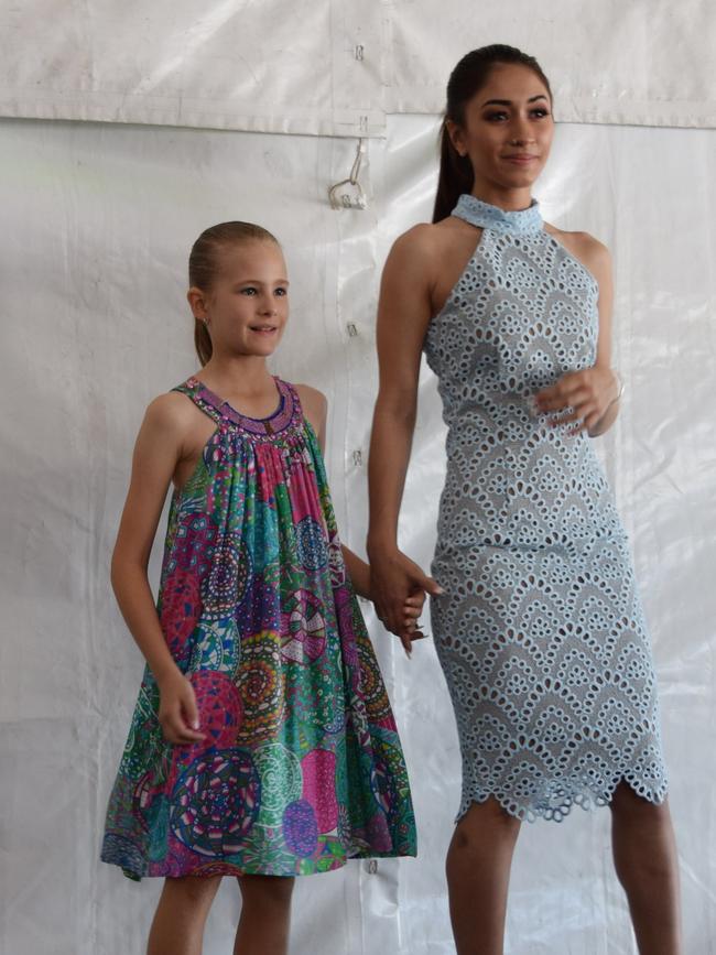 Mercury Mowen and a young model strut their stuff in fashion from Can I Wear That and Willow & Ivy at the 2016 Capricorn Food and Wine Festival.