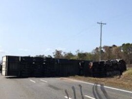 A semi-trailer lies across the Bruce Highway following a fatal crash. Picture: RACQ CQ Rescue