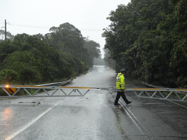 Flooding on the Wakehurst Parkway forced police to close the road on Wednesday. Picture: John Grainger