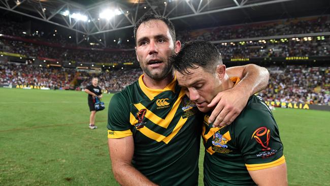 Cameron Smith of Australia (left) and teammate Cooper Cronk celebrate winning the Rugby League World Cup final match between the Australian Kangaroos and England at Brisbane Stadium in Brisbane, Saturday, December 2, 2017. (AAP Image/Dan Peled) NO ARCHIVING, EDITORIAL USE ONLY