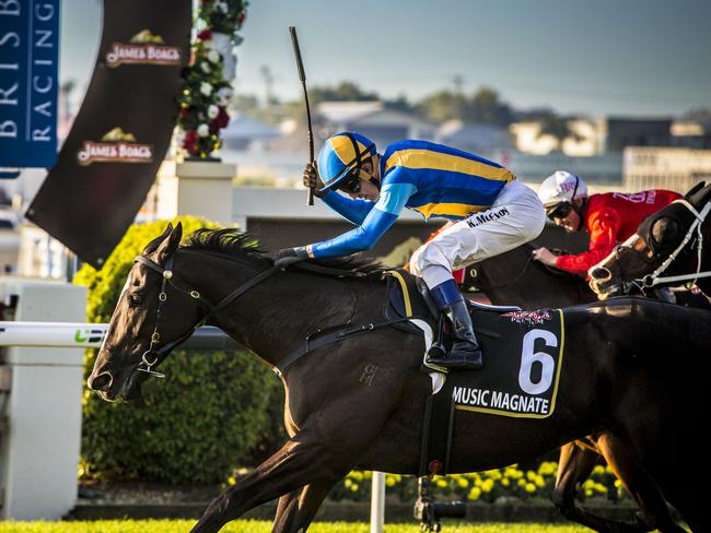 Kerrin McEvoy celebrates as Music Magnate crosses the finish line. Picture: AAP